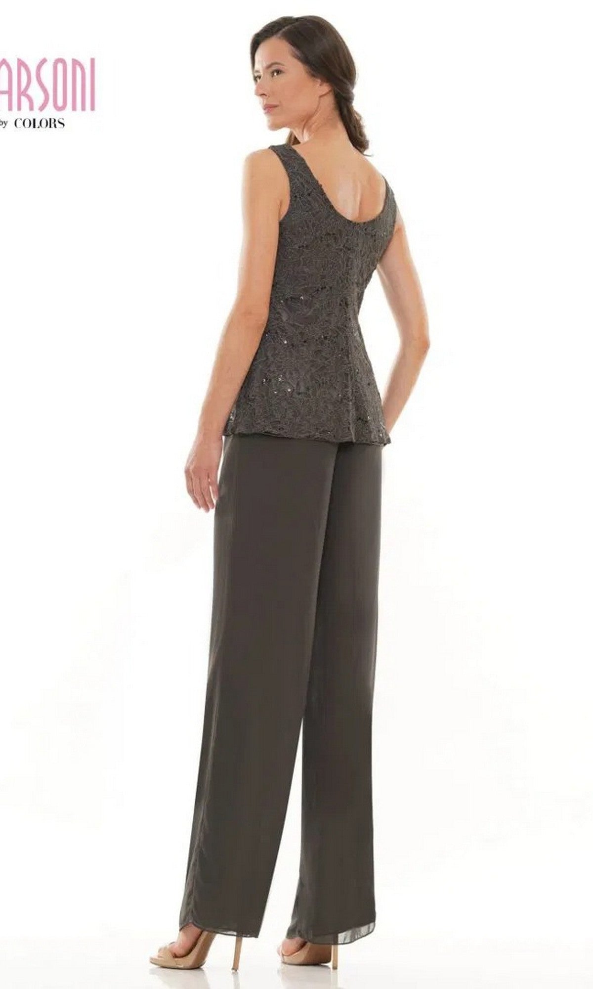 A woman stands in profile, facing away, wearing the Marsoni M305 Long Formal Pantsuit—sleeveless and textured top with chiffon pants—against a plain white background.
